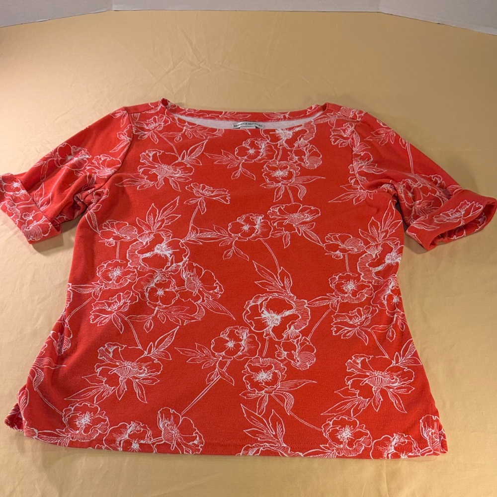 Women’s top by Rebecca Malone, floral pattern size large, cuffed, short sleeves